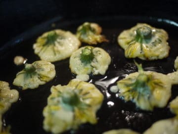 dandelion fritters in a skillet