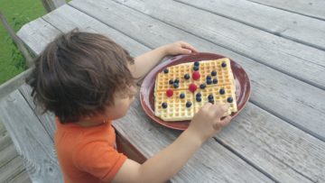 Max eating sourdough kefir waffles with berries