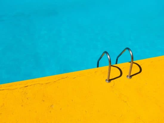 Yellow and blue pool with ladder