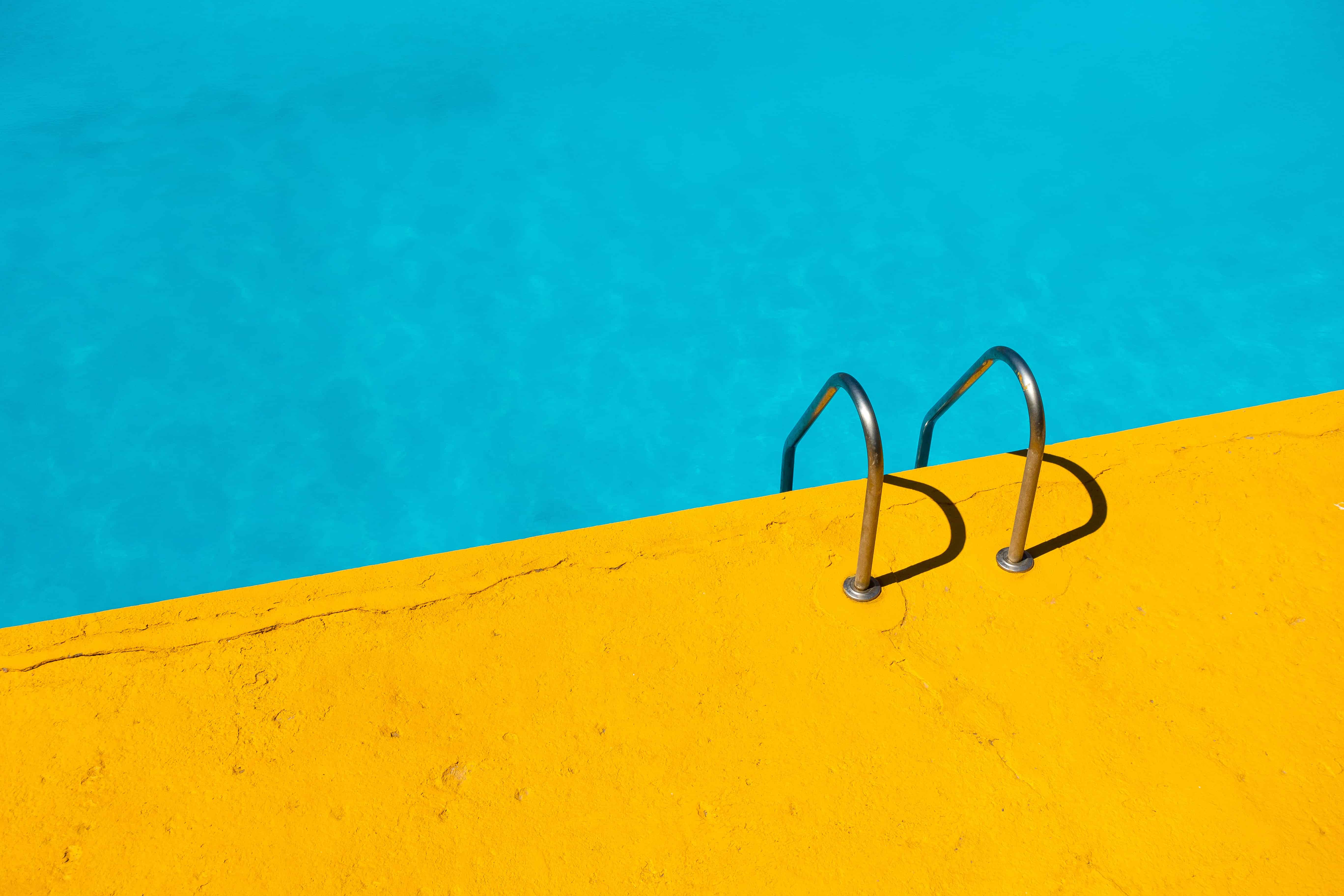 Yellow and blue pool with ladder