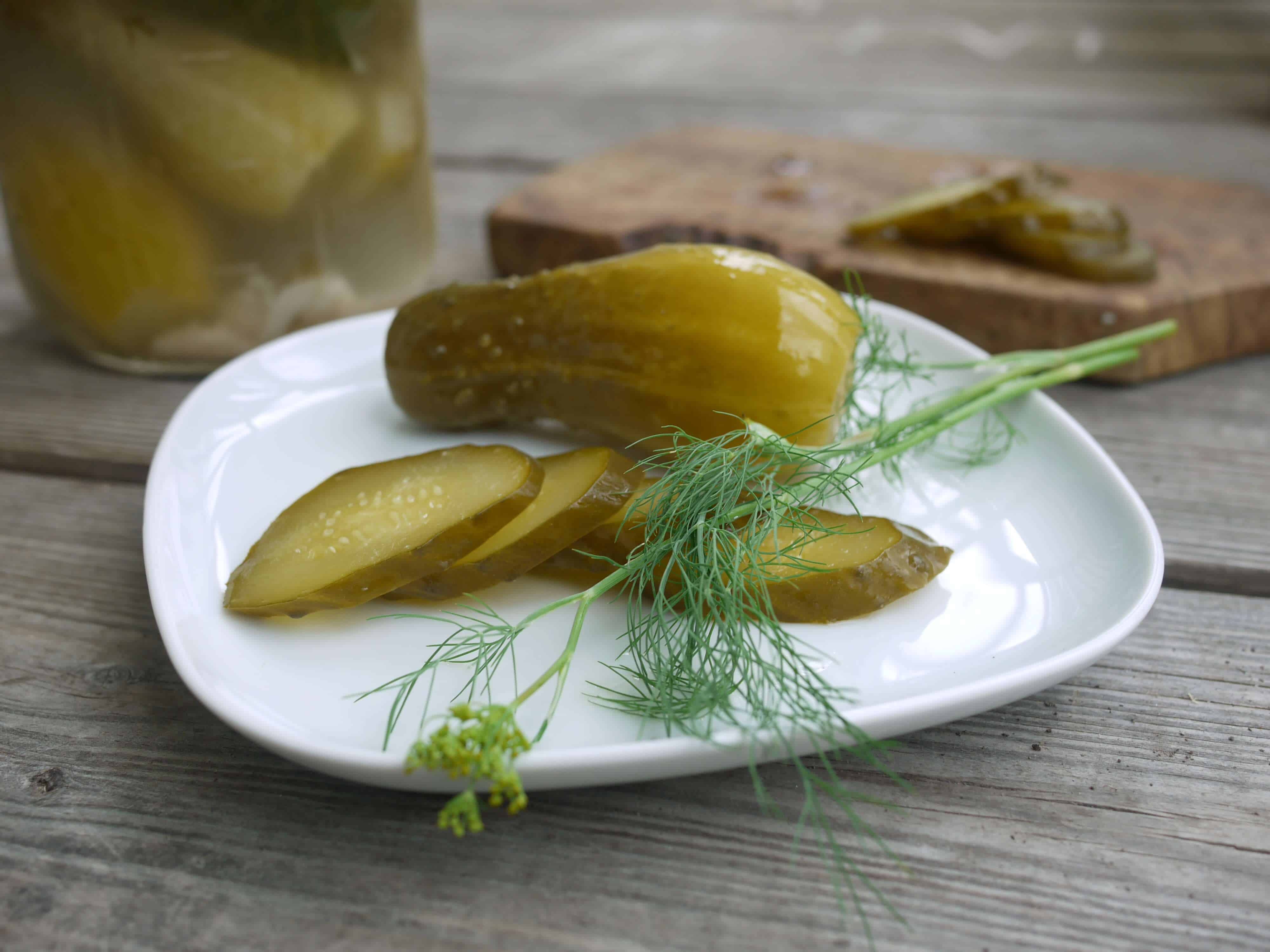 Sliced brined pickles on a plate