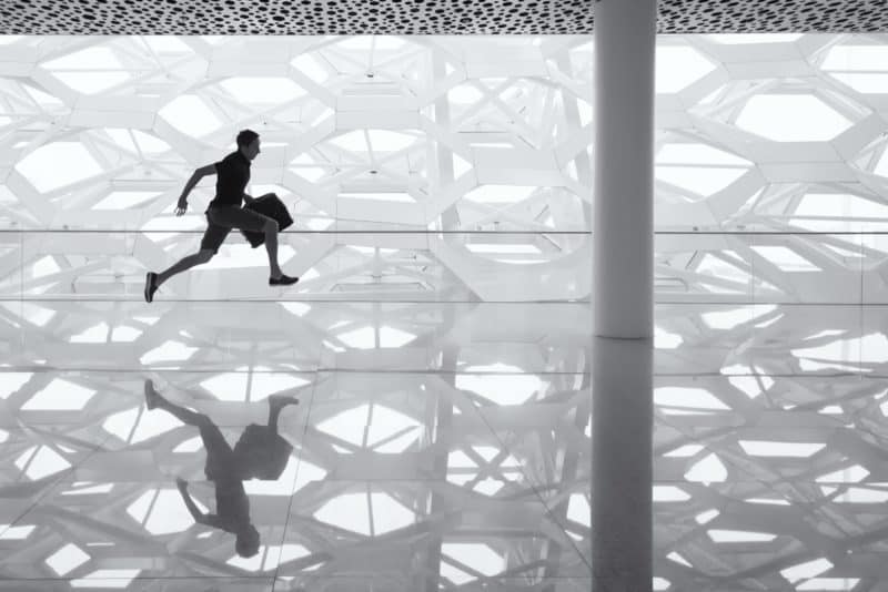 Man sprinting with bag