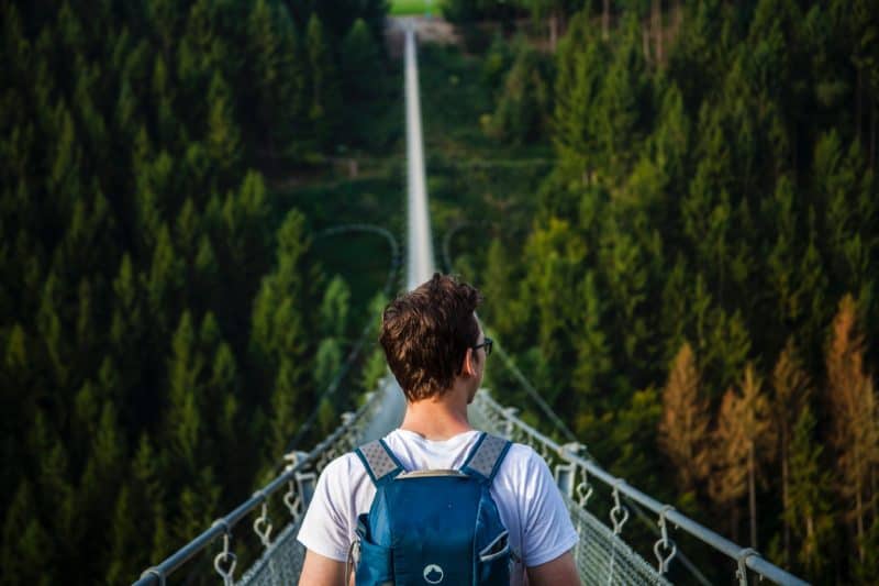 Man on suspension bridge